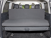 The iXTEND folding bed can be unfolded and leaned against the 3-seater bench of the Mercedes-Benz Marco Polo HORIZON.