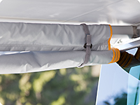 The side panel can also be rolled up and fixed to the awning arm.